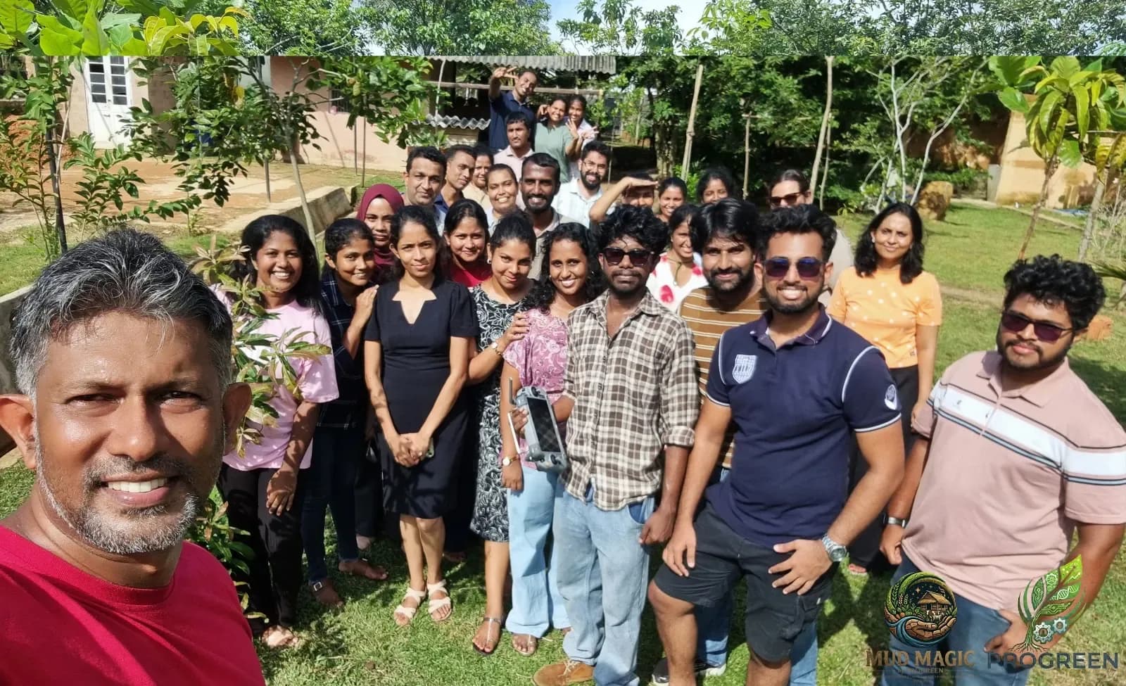 A programme group gathered under the trees