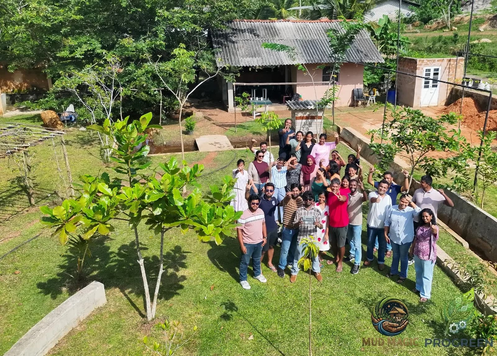 A wide view of Mud Magic Park with a visiting group